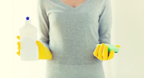 End of tenancy cleaning team working in a Belsizepark apartment kitchen