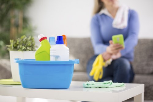 Professional cleaners maintaining desks and meeting rooms in Belsizepark